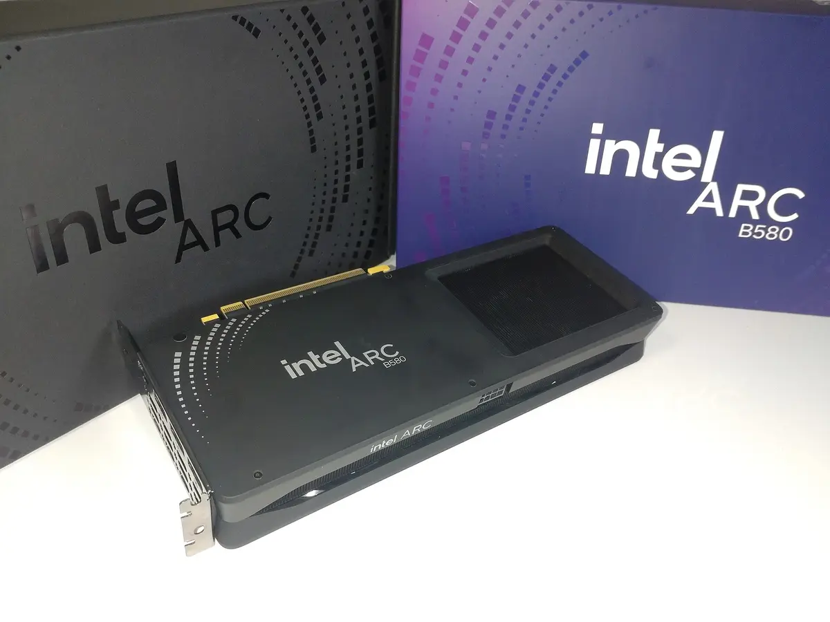 Intel Arc B580 Limited Edition graphics card standing in front of its retail box